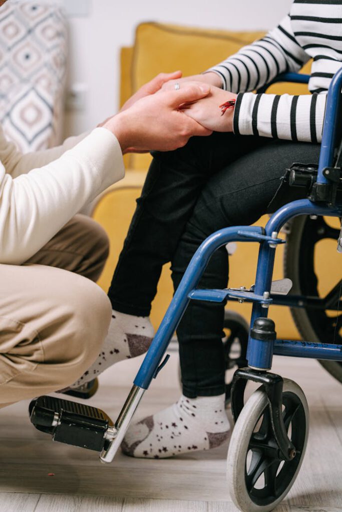 pexels photo 8127501 Supportive interaction between caregiver and wheelchair user, showing compassion.